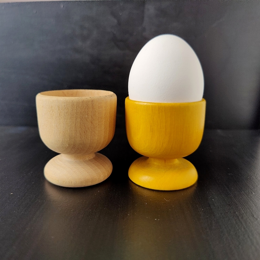 2 decorative wooden egg cups - 1 natural wood 1 yellow